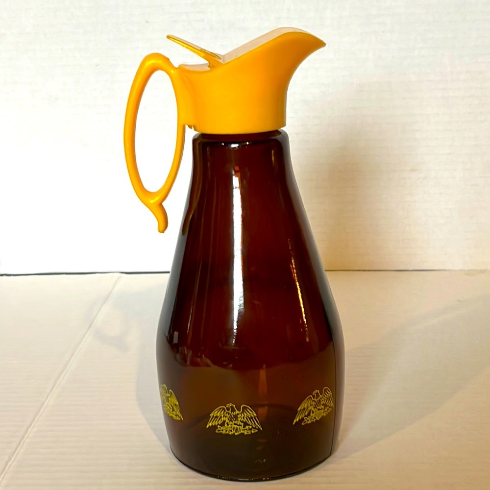 Vintage Log Cabin Eagle Brown Glass Syrup Pitcher w/ Yellow Pouring Lid